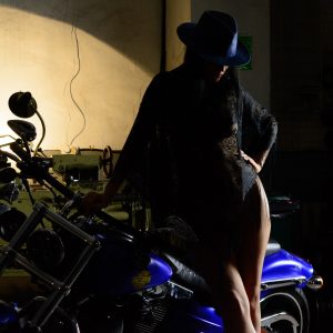 Photo session of NUDE Glamor in the garage. Girl and Harley. Iren Adler. Pablo Incognito