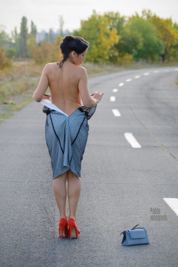 Nude model Iren Adler performed a striptease on the road. Photo by Pablo Incognito