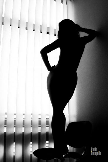 Silhouette of a naked girl at the hotel window. Nude photo by Pablo Incognito