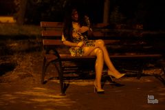 The girl undresses on a park bench at night. Nude photo by Pablo Incognito