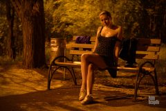 The girl is flirting. Posing in the park at night on a bench. Nude photo by Pablo Incognito