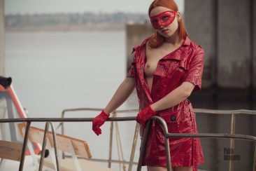 Redhead on a yacht showed her bare chest