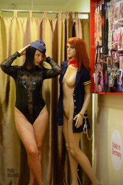 Woman in bodysuit and naked mannequin