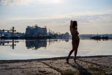 Photo shoot nude in backlight in the harbor, photo