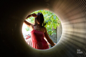 Girl posing in the tube. Topless photo. Pablo Incognito