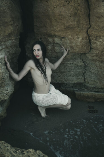 Half-naked wet girl in the rock, photo