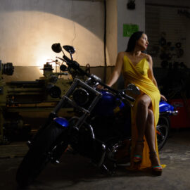 Girl in a luxurious yellow dress on a blue brutal motorcycle nude photo