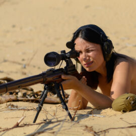 Naked and sexy sniper in the desert photos