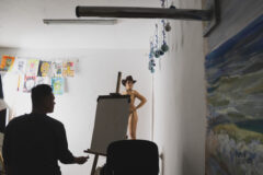 Photo backstage in an art studio model posing nude