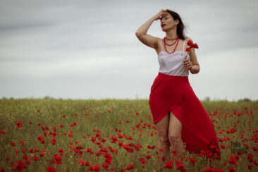 Glamorous photo session in poppies girl in a red skirt nude photo