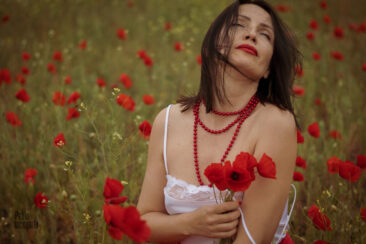 Portrait of sexy woman in poppies nude photo