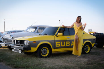 Posing near retro Subaru nude photo