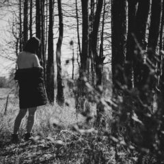 А half-naked girl in a black forest. Nude photo by Pablo Incognito