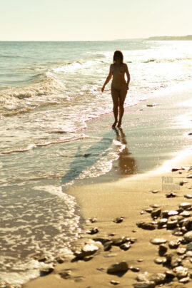 Nudist Walking Alone On The Beach