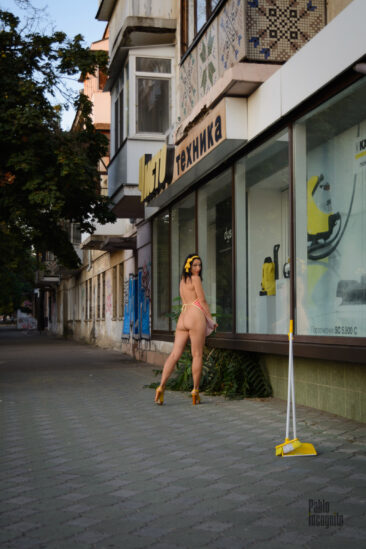 Iren Adler poses nude as a cleaner in a vacuum cleaner store. Photo by Pablo Incognito