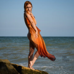 Redhead girl posing nude on a wild beach. Photographer Pablo Incognito