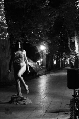 Black and white nude with undressing on the street