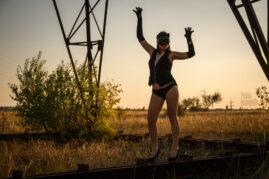 Cat woman in a nude photo session near the power line. Photo by Pablo Incognito