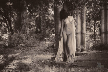 Naked near a column in the park. Black and white retro nude. Pablo Incognito