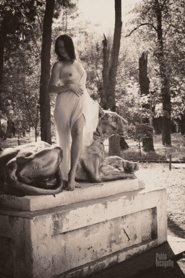 Semi-nude beauty and lioness garden sculpture. Nude in the park. Pablo Incognito