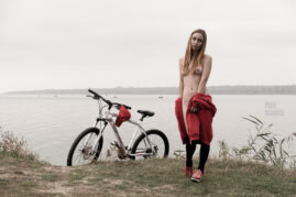 Naked girl with a bicycle. Pablo Incognito