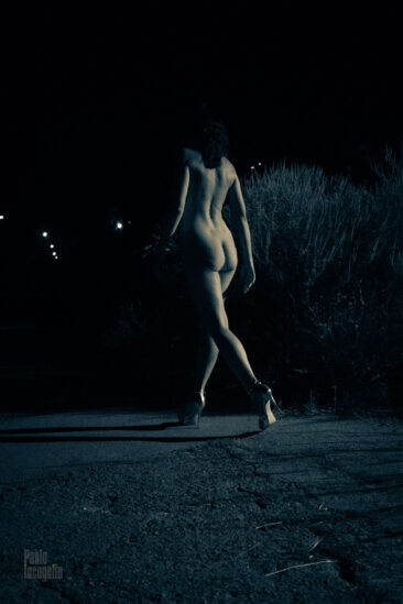 Naked walking down the street at night, photo from the back