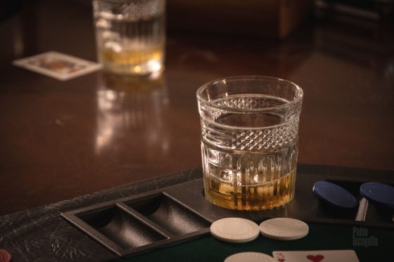 Glass of whiskey and poker chips